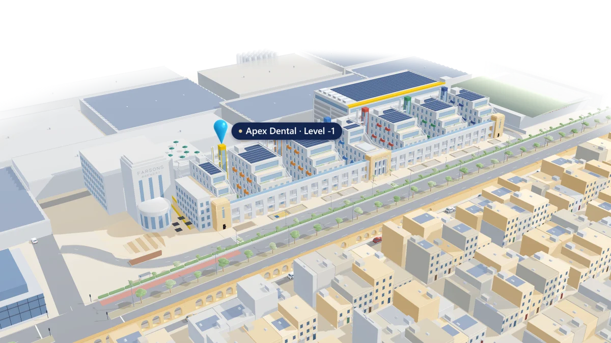 Our two clinics in Birkirkara, modelled as they are: Trident Park in Mrieħel, the long white colonnade on Mdina Road with its office blocks and coloured lift shafts, where a blue pin marks Apex Dental at Block 2's yellow lift shaft, Level -1; a gold line arcs north-west to St Anne's Clinic, the cream limestone corner building with balconies, where a second pin settles on Level 3 as its windows light up; then both are seen together, joined by the line